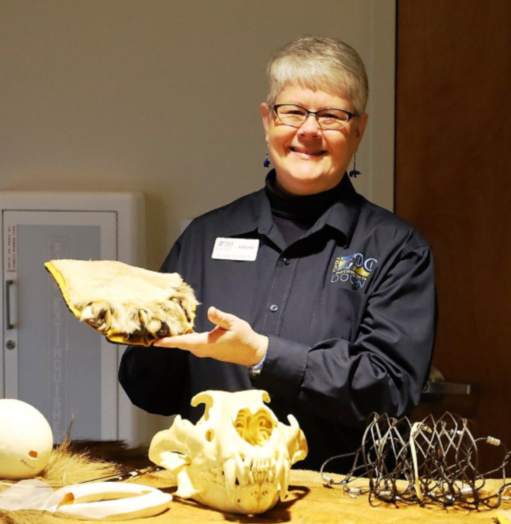 female docent holding animal artifact at Topeka Zoo